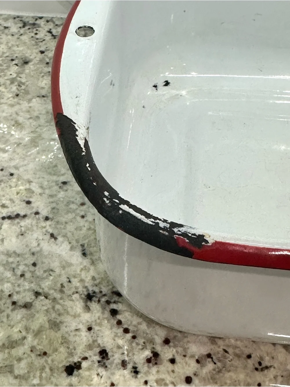 Vintage white enamel pan with red trim